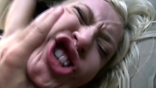 Striking blonde works her lips and her pussy on a big pole in the car