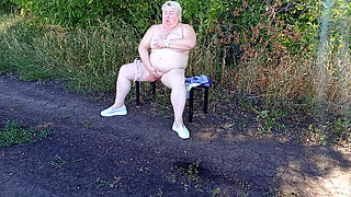 A Neighbor in the Park Undresses and Masturbates to Orgasm on a Bench