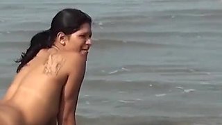 Horny married woman in public nudity records video having fun on the beach