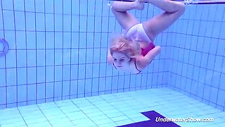 Proklova takes off her bikini and dives under the water