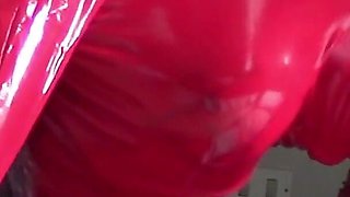 MILF in Red Latex Suit and Patent Leather High Heels Gives a Blowjob with Swallow