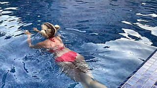 Blonde bombshell gives a sloppy blowjob by the pool