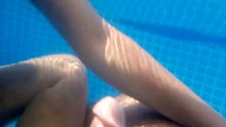 Underwater foot job in backyard pool