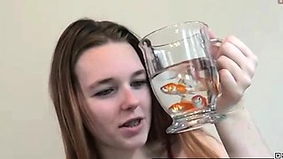 Pretty hungry girl swallows innocent fish - Vore