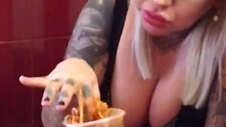 Blonde tattooed milf eats spaghetti on the toilet