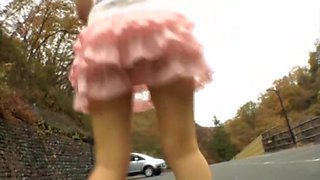 Asian teen bends over and shows horny upskirt in the street