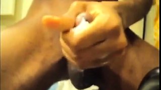 Black guy jacks off his big cock and cums hard