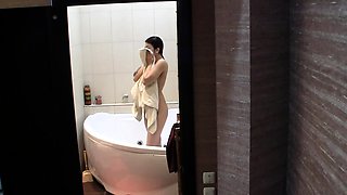Stunning brunette getting of the shower naked