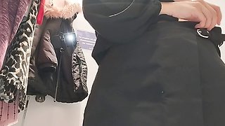 Naughty wifey strips down to try on clothes, dark-haired with a hairy pussy, big tits, and a round ass