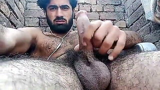 hairy guy tugging his big dick outdoor living