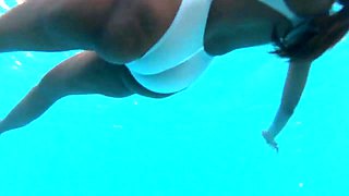See-through white swimsuit in public pool
