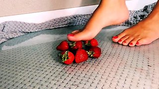 Amateur femdom mistress crushing strawberries barefoot
