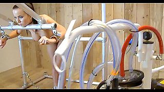 Petite Girl strapped on milking machine