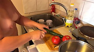 Zara is cooking topless in the kitchen