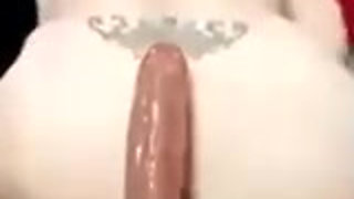 Riding a big dildo (27 cm)