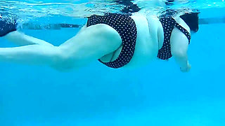 Couple Underwater Diving and Swimming