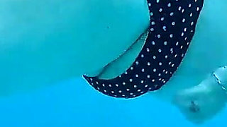 Couple Underwater Diving and Swimming