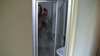 Spy cam watches chick shower
