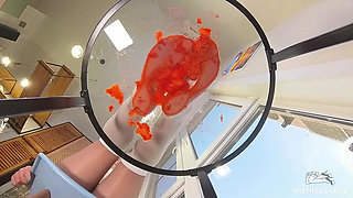 My Nylon Feet Squeezing Strawberry Juice on a Glass Table