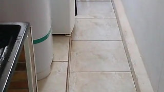 Blonde in thong panties showing off in the laundry