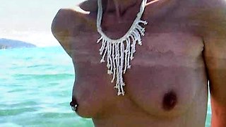 Blonde is flashing her big boobs in the outdoors