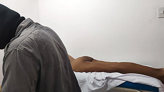 The doctor gives his patient a massage to relieve stress