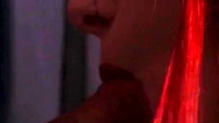 Redhead nurse sucks cock at a gloryhole