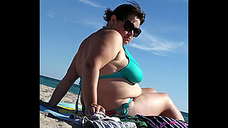 Huge boobs huge ass on a beach