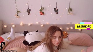 Petite plays on bed