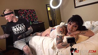 Busty brunette Misha Montana gets a new leg tattoo