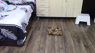 Amateur woman has fun trying on clothes and cutting them. Amateur woman vacuums naked in the house.