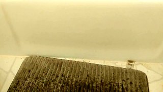 Horny babe gives herself multiple orgasms in the shower