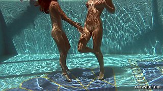 Two adorable hotties Olla Oglaebina and her nasty girlfriend are swimming in the pool