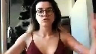 Brunette with glasses masturbates hairy pussy