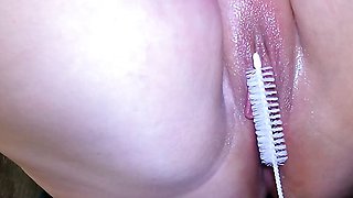 Inserting a brush into her vagina during a picnic