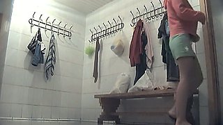 Sexy young brunette girl in the locker room undresses on hidden cam