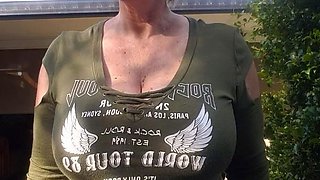 Blonde is flashing her big boobs in the outdoors