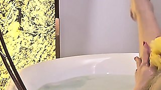 MILF with Huge Tits Teases in the Bath