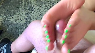 Sensuous housewife rubbing cock with her fabulous feet