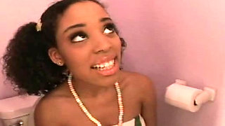 Young ebony girl sucking cock sitting on the toilet 1