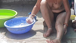 Stepsister desi in beautiful red tights is bathing completely naked in the open bathroom in the stepsister red tights