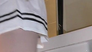 Cute and Hot Sexy Tight Pussy Cheerleader Shows Her Shaved and Wet Pussy Under Her Mini Skirt in the Bathroom