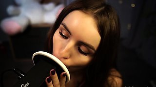 Sensual ASMR ear licking session with alluring camgirl