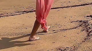 A Busty Blonde Is Walking and Sunbathing Naked