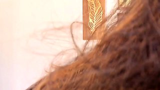 Busty curly brunette with big boobs fucks on couch