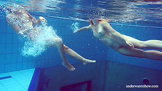 Blonde and Brunette babes swim naked