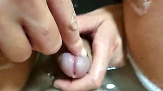 Polish amateur girl plays with her penis in bathtub, finger insertion in urethra