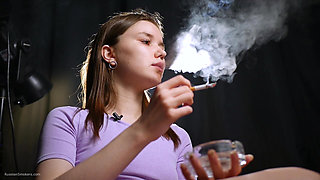 18 Aged Girl Is Smoking Two Strong Cork Cigarettes