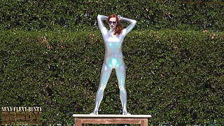 Bending in a Silver Spandex Suit