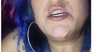 Close-up lips wrapped around a cigarette, smoke curling in the air